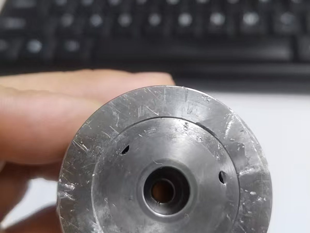 Returned cold heading die face photographed for internal failure inspection