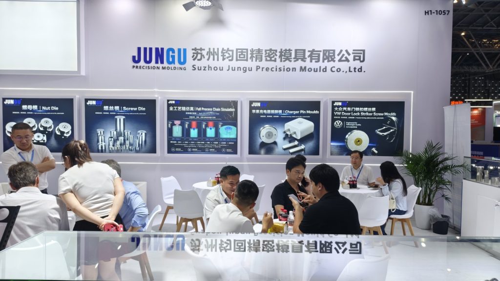Jungu booth discussion area with fastener mould application boards at the Shanghai exhibition